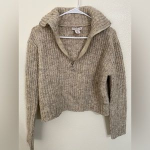 Cropped beige knitted sweater
